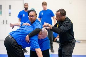 Private Security Academy students with instructor learning subject control